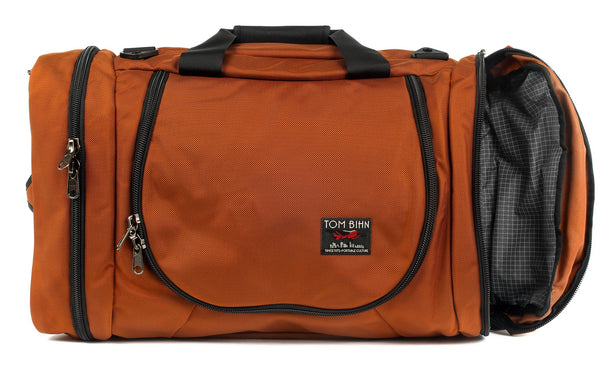 A Burnt Orange 1050 Ballistic Aeronaut 45 with the end pocket open showing the Northwest Sky (light-grey) Halcyon.